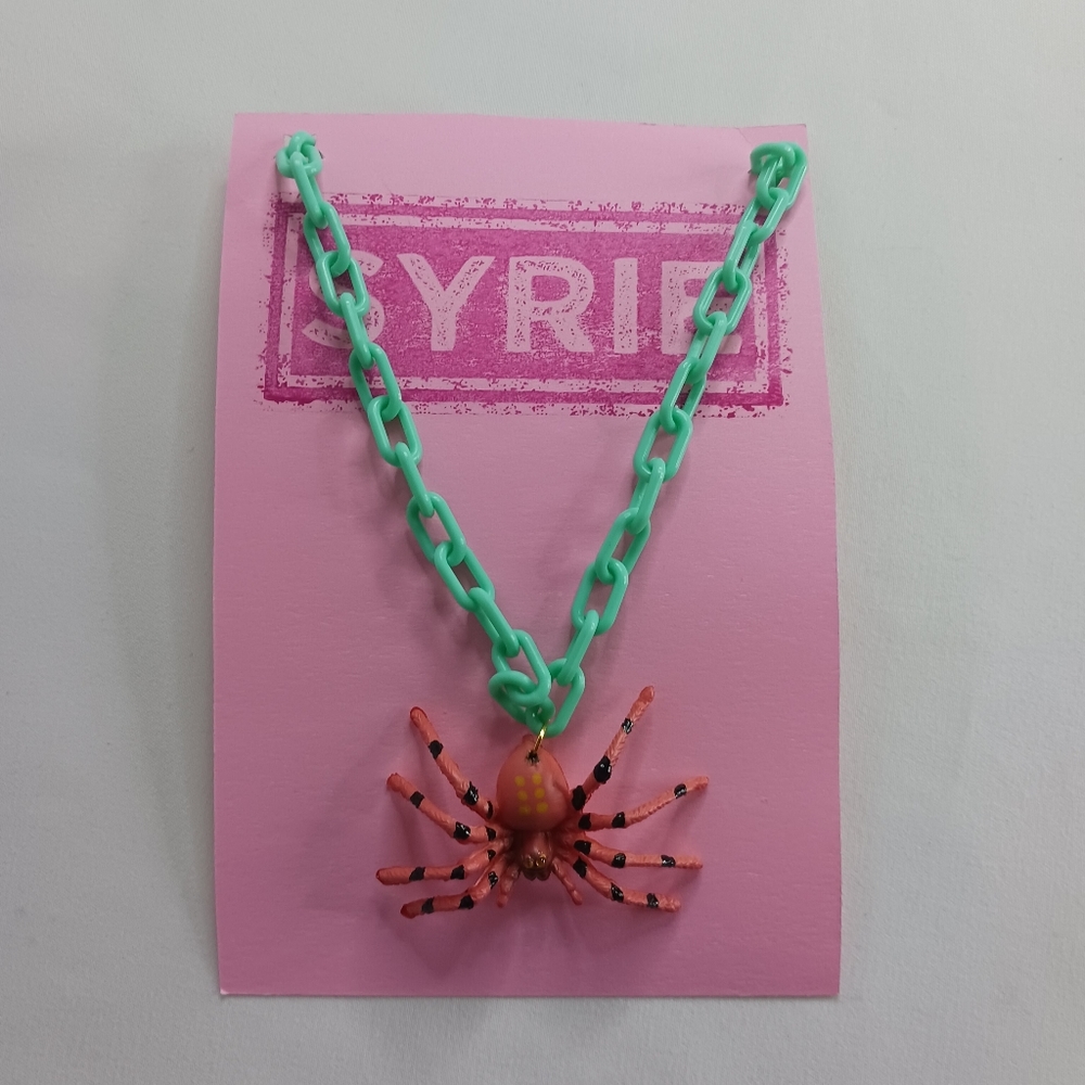 Aqua Plastic Link Orange Spider Necklace with Yellow Rhineston Eyes.